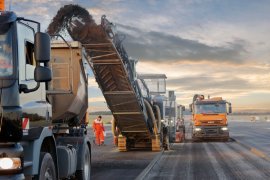 the big milling device works through the pavement at increased advance rate.